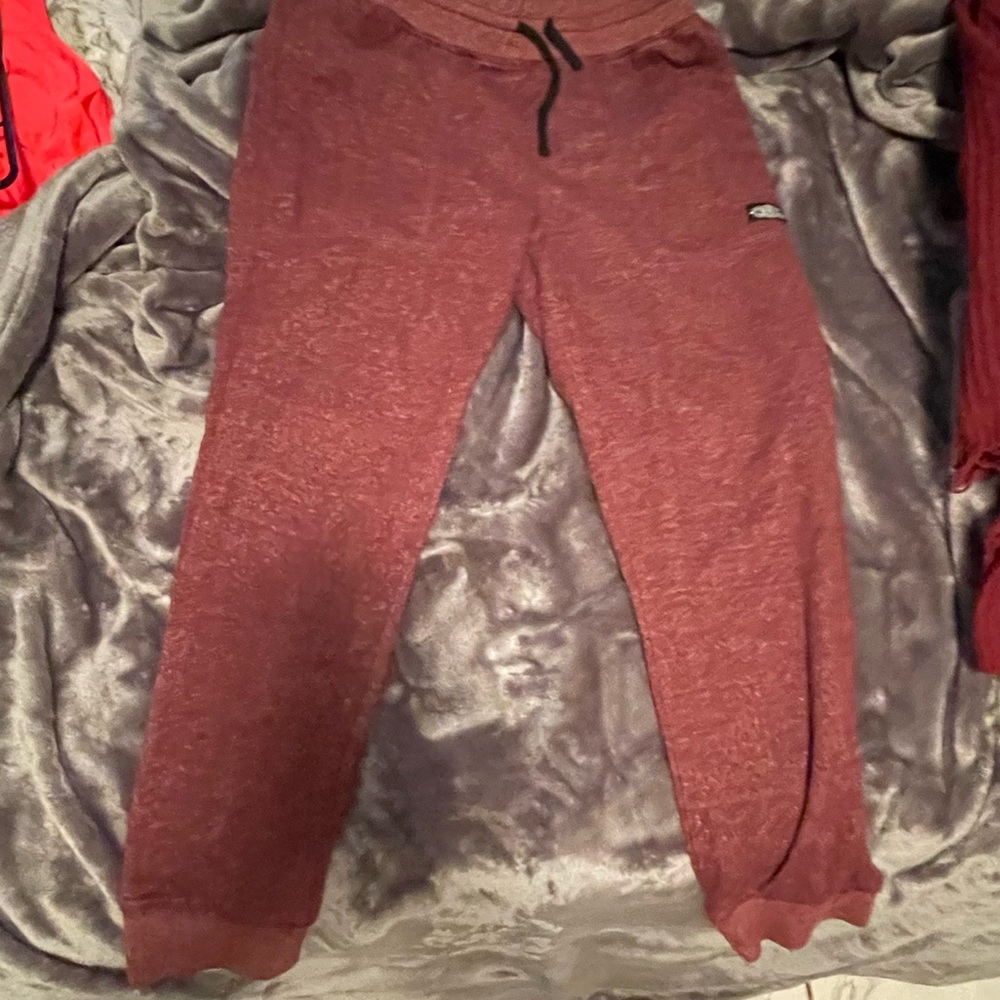 Maroon sweatpants and is used